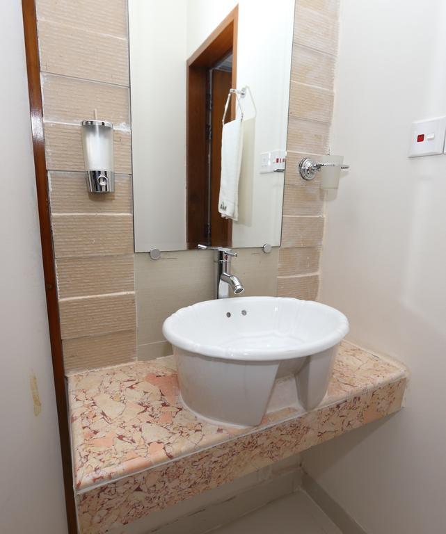 Naas Serviced Apartments Дакка Номер фото